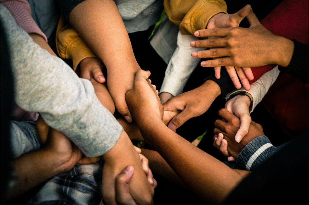 Joined hands symbolizing unity