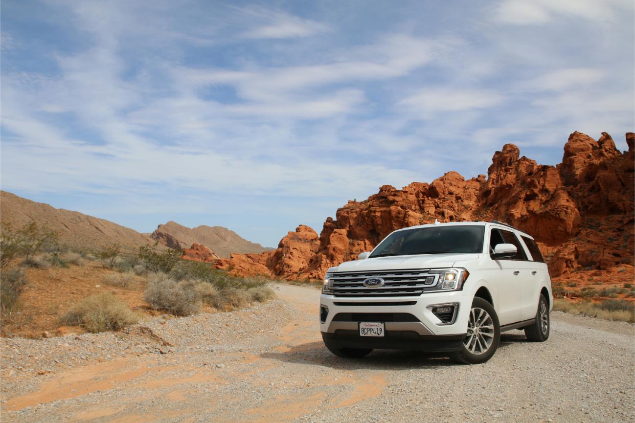 White SUV on dirt road